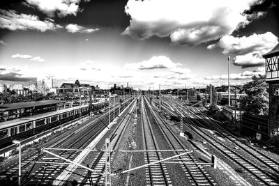 High angle view of railroad tracks in city against sky