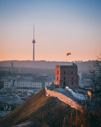 Buildings in city at sunset