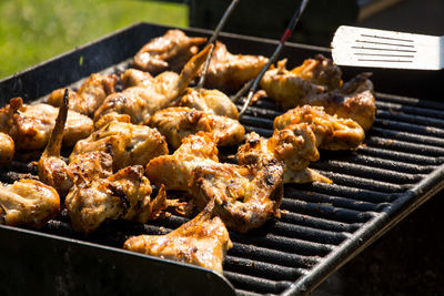 High angle view of chickens roasting on barbecue