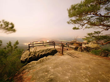 Scenic view of rocks against sky during sunset