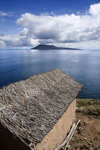 Traditional house in the lacustrine landscape of titicaca on the border of bolivia and peru
