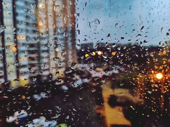 Full frame shot of wet glass window in rainy season