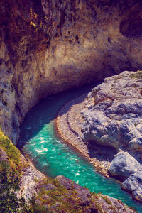 High angle view of rock formation in sea