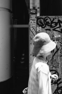 Rear view of boy standing outdoors