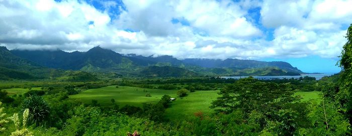 Scenic view of mountains against cloudy sky