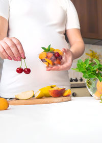 Midsection of man preparing food on table