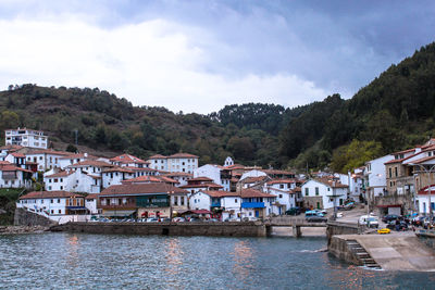 View of townscape with river in foreground