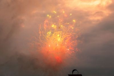 Low angle view of firework display in sky at night