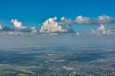 Aerial view of landscape and sea against sky