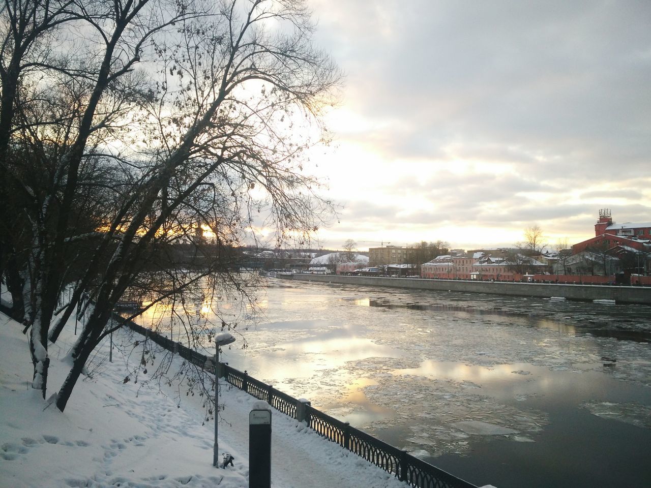 winter, cold temperature, nature, snow, water, sky, bare tree, outdoors, beauty in nature, no people, tree, river, tranquility, scenics, cloud - sky, built structure, architecture, building exterior, day