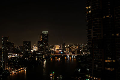 Illuminated buildings in city at night