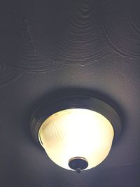 Close-up of illuminated light bulb