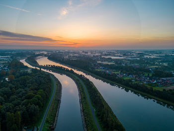 High angle view of cityscape against sky during sunset