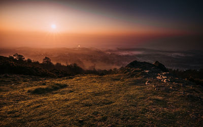 Scenic view of landscape against sky during sunset