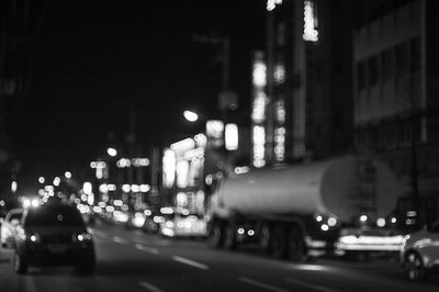 Defocused image of traffic on city street at night