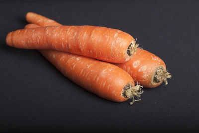 High angle view of carrots on black background