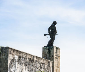 Low angle view of statue against sky