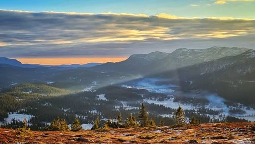 Scenic view of mountains against sky during sunset