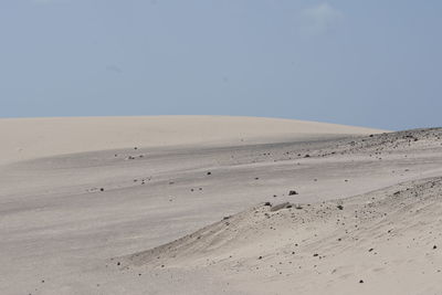 Scenic view of desert against clear sky