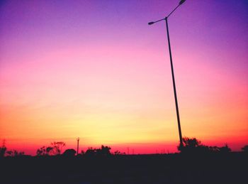 Low angle view of silhouette trees against sky at sunset