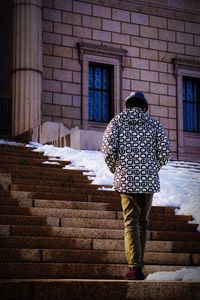 Woman standing on sidewalk