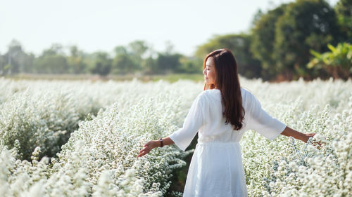 Full length of woman standing on field