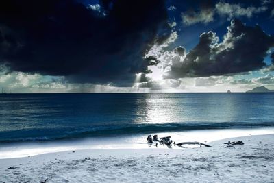 Scenic view of sea against cloudy sky