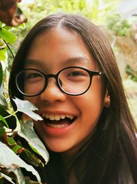 Close-up portrait of a smiling young woman