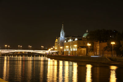 Illuminated buildings at waterfront