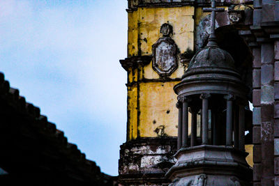 Low angle view of old building against sky