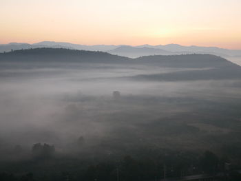 Scenic view of mountains against sky during sunset