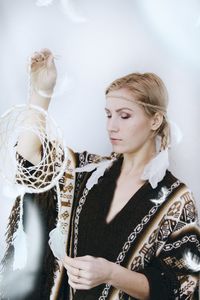 Young woman with dreamcatcher