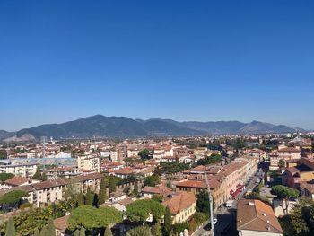 High angle shot of townscape against clear blue sky