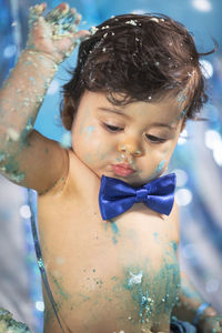 Portrait of cute baby boy in smash cake 