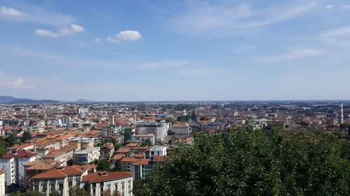 Aerial view of townscape against sky