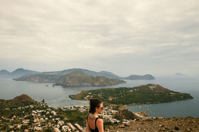 Woman looking at view against mountains