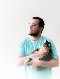 Smiling young man against white background