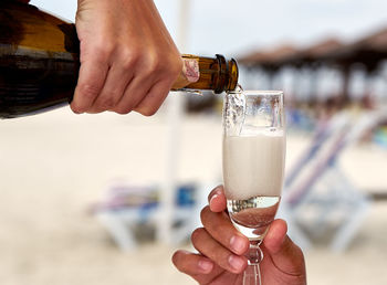 Close-up of champagne man being served champagne in glass