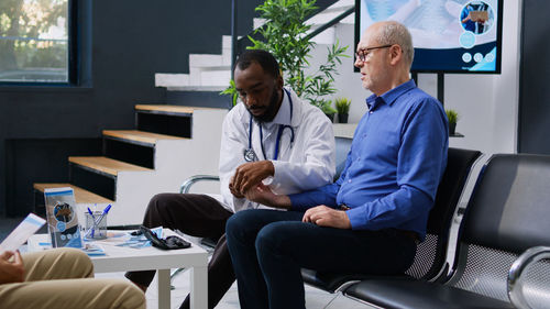 Portrait of doctor using laptop on table