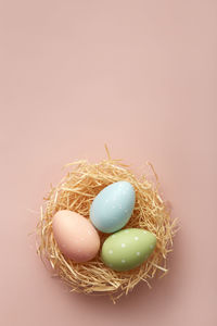 High angle view of easter egg on yellow background