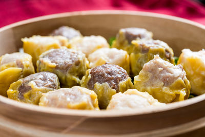 Close-up of chinese dumplings in bamboo basket