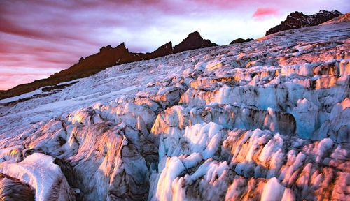 Scenic view of snow mountains against sky