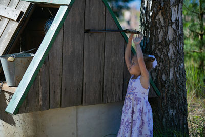 Rear view of woman standing in park