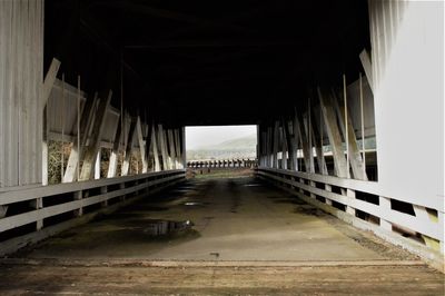 Bridge over road amidst buildings