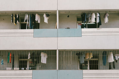 Low angle view of laundry drying in balcony