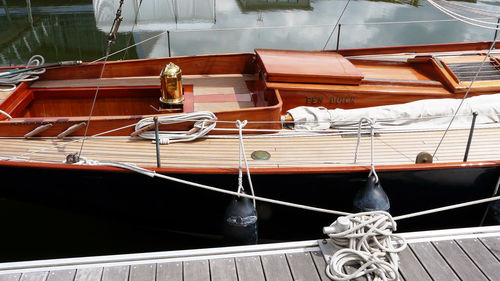 High angle view of boats moored on rope