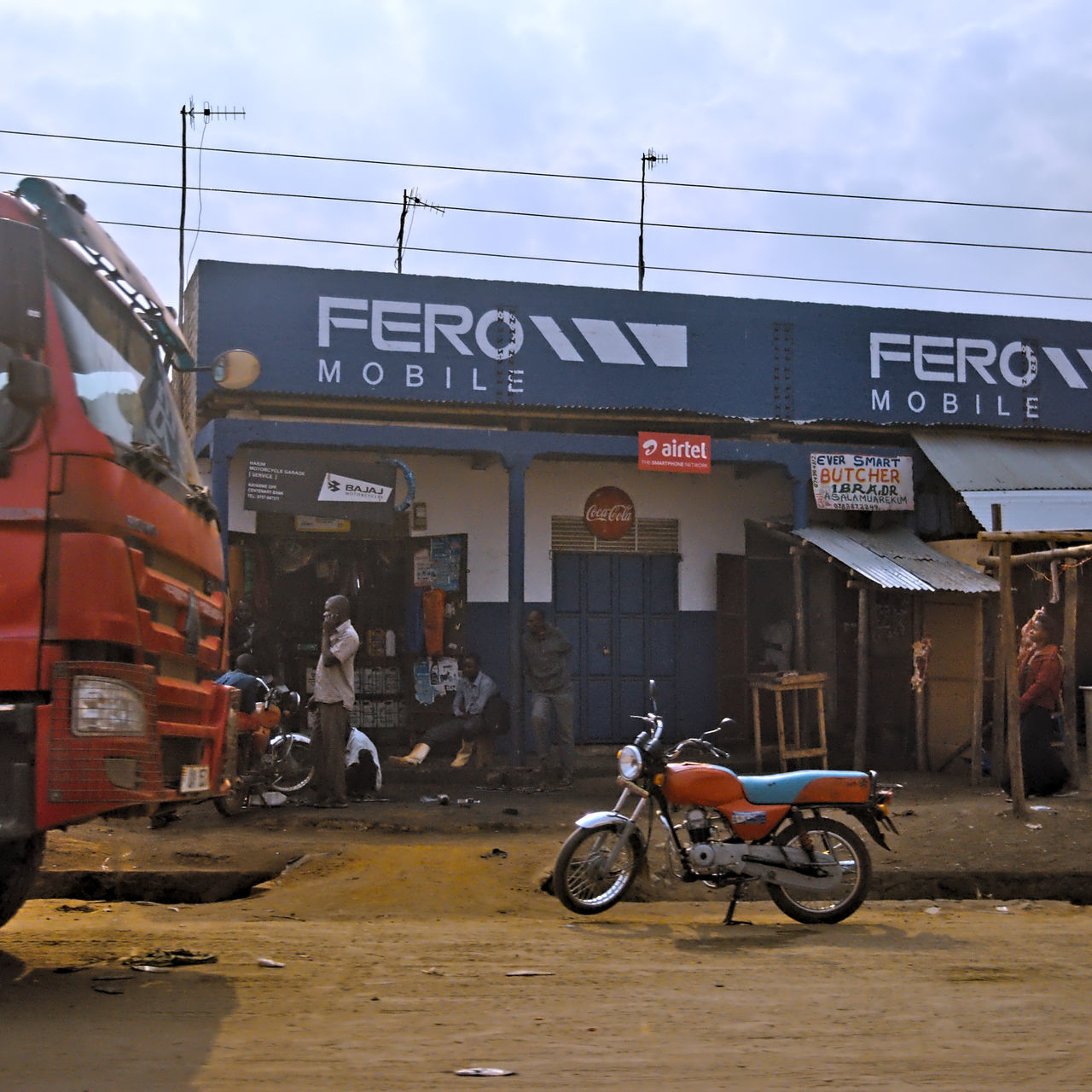 transportation, mode of transportation, text, land vehicle, architecture, building exterior, built structure, communication, western script, bicycle, day, sign, city, real people, script, non-western script, street, information, nature, outdoors