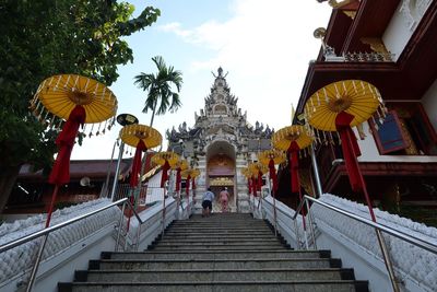 Low angle view of people walking on staircase