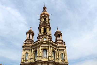 Low angle view of bell tower against sky