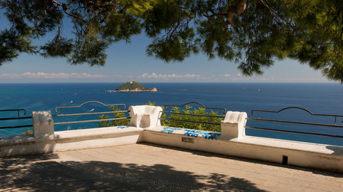 Scenic view of swimming pool by sea against sky